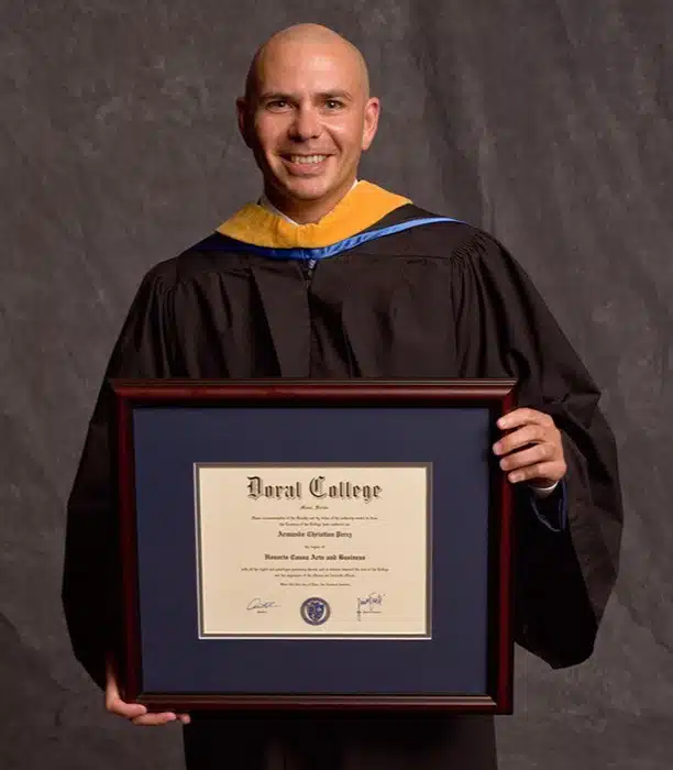 Pitbull graduating with diploma